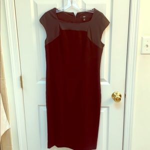 Fitted black dress with faux leather top